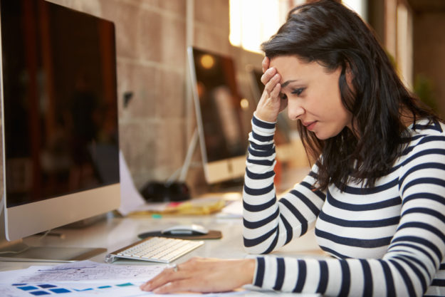 Stressed Female Designer Works At Computer In Modern Office Study About Starting A Small Business